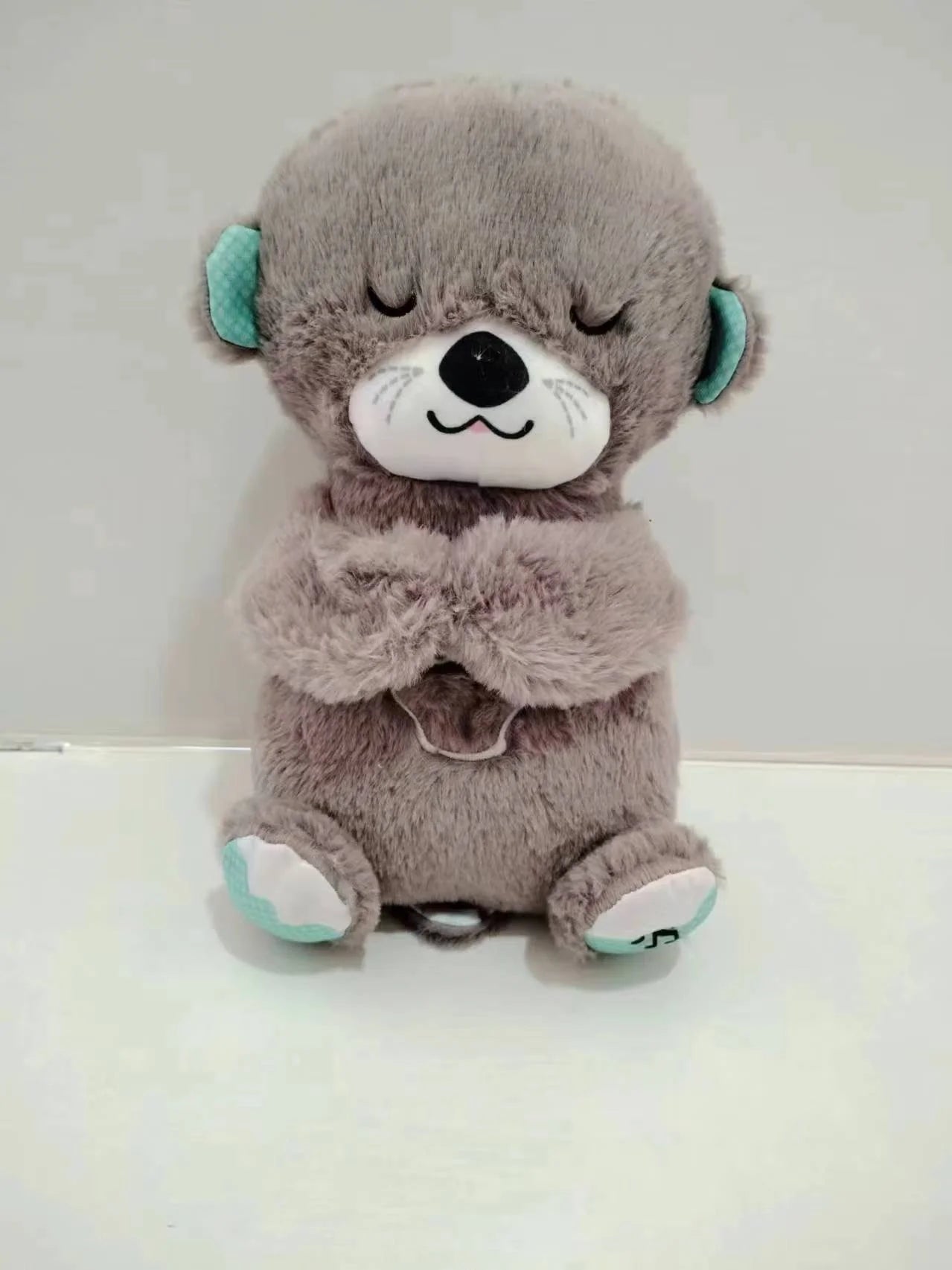 SleepNest Soothing Otter Plush Sound Machine night light feature